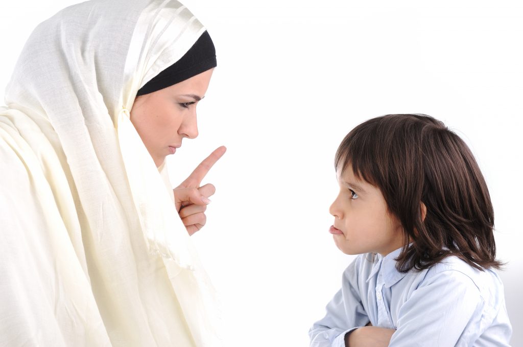 Muslim mother threating her son